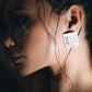 laundry tag earrings